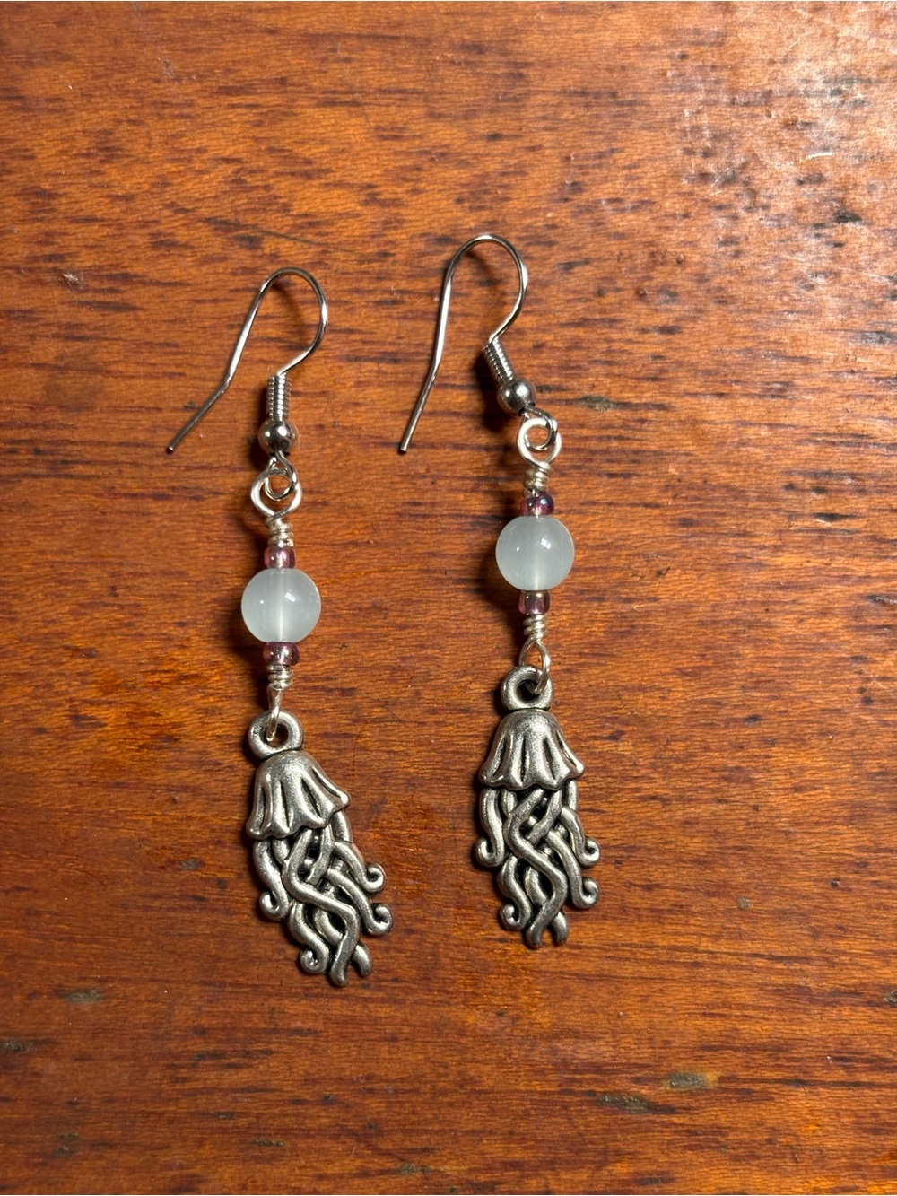 Silver Jellyfish Dangle Earrings with light blue stone Bead